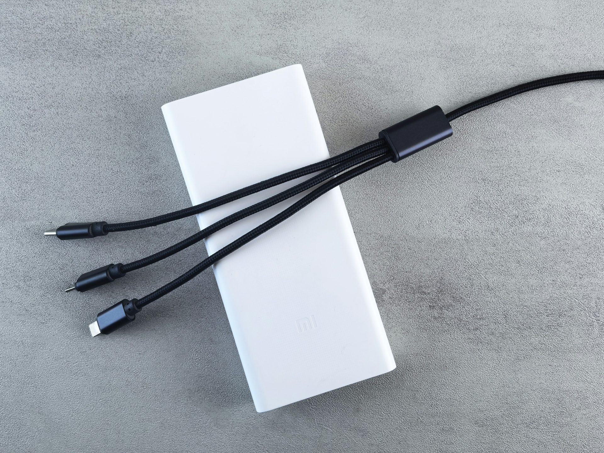 White power bank with three charging cables